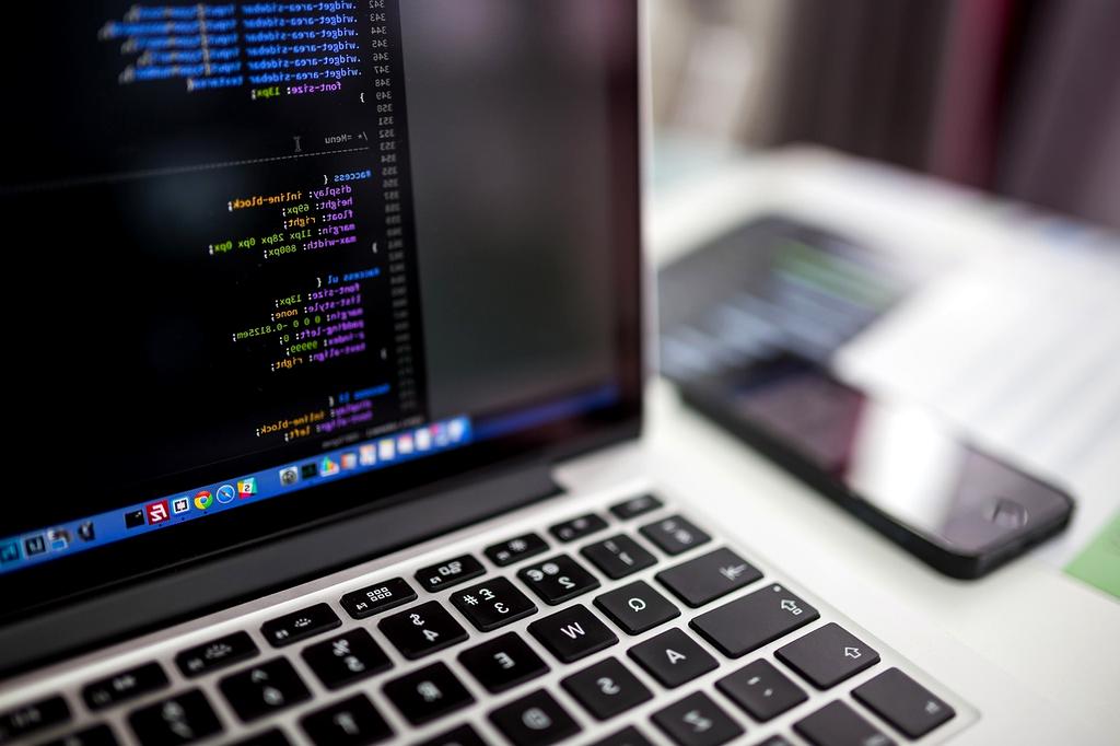 Team of developers collaborating on a project in a modern office