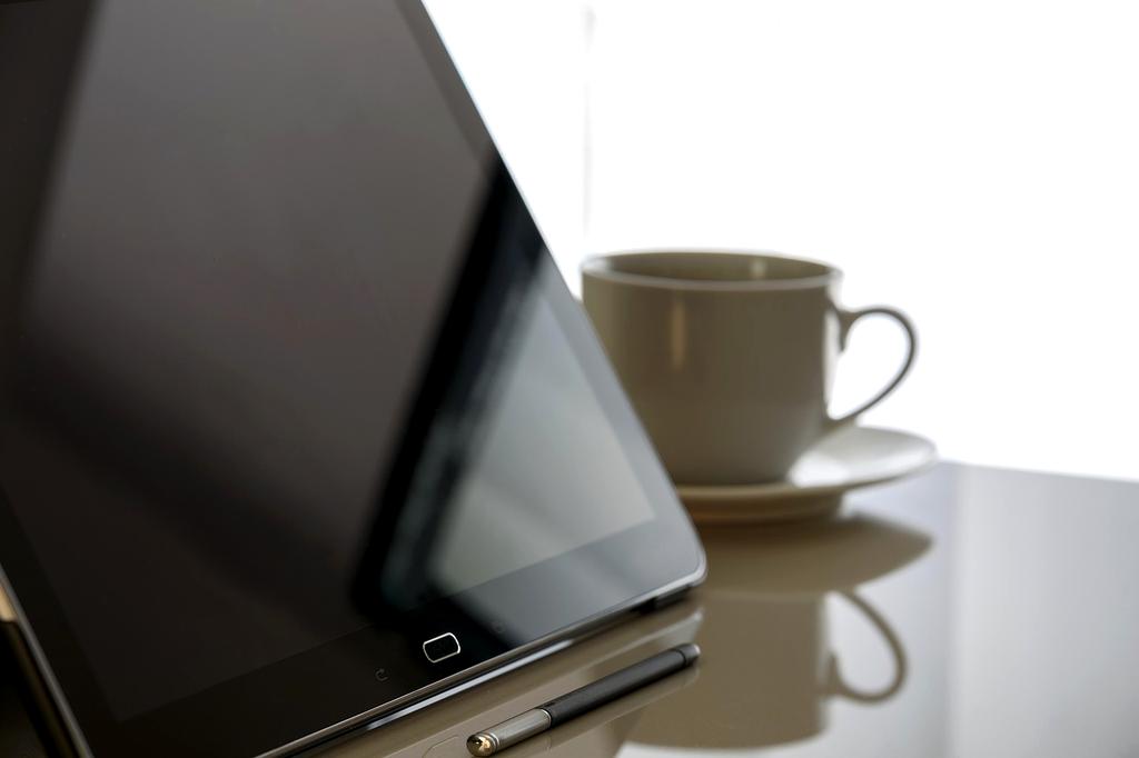 Financial analyst viewing stock market data on multiple screens